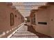 Outdoor patio area with a decorative pergola and tiled flooring at 7250 Birkland Ct, Las Vegas, NV 89117