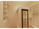 Custom walk-in closet with built-in shelving and drawers for optimal storage solutions at 7250 Birkland Ct, Las Vegas, NV 89117