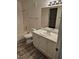 Traditional bathroom with updated wood-look flooring at 7716 Bauble Ave, Las Vegas, NV 89128