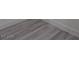Close-up of stylish gray wood-look flooring, showcasing the modern aesthetic and easy maintenance at 7716 Bauble Ave, Las Vegas, NV 89128