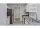 Well-appointed kitchen featuring granite countertops, white cabinets, and stainless steel appliances at 7716 Bauble Ave, Las Vegas, NV 89128