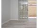 Bright living room with sliding glass doors to the patio and stylish laminate flooring at 7716 Bauble Ave, Las Vegas, NV 89128