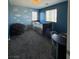 Bedroom with dark blue walls and window at 7760 Trends Ct, Las Vegas, NV 89149