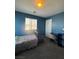 Bedroom with dark blue walls and window at 7760 Trends Ct, Las Vegas, NV 89149