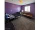 Cozy bedroom with a futon, and window at 7760 Trends Ct, Las Vegas, NV 89149