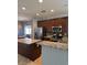 Modern kitchen featuring granite countertops, stainless steel appliances, and ample cabinet space at 7760 Trends Ct, Las Vegas, NV 89149
