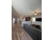 Spacious living room with a view of the kitchen and plenty of natural light at 7760 Trends Ct, Las Vegas, NV 89149
