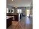 Open-concept living space features wood flooring, large windows, and modern finishes at 7760 Trends Ct, Las Vegas, NV 89149