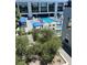 Aerial view of the community's pool, lounge areas, and cabanas at 8925 W Flamingo Rd # 105, Las Vegas, NV 89147