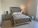Well-lit bedroom showcasing mirrored furniture, stylish bed, and ample space at 8925 W Flamingo Rd # 105, Las Vegas, NV 89147
