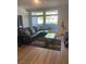Cozy living room featuring a comfortable sectional sofa, area rug and large windows at 8925 W Flamingo Rd # 105, Las Vegas, NV 89147