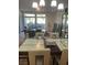 Open-concept living room and dining room with large windows allowing natural light and comfortable seating at 8925 W Flamingo Rd # 105, Las Vegas, NV 89147
