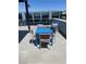 Outdoor seating area with a table and chairs on a rooftop patio with great views at 8925 W Flamingo Rd # 105, Las Vegas, NV 89147
