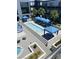 Aerial view of pool featuring cabanas, lounge chairs and well-manicured landscaping at 8925 W Flamingo Rd # 105, Las Vegas, NV 89147