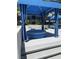Relaxing blue cabana sitting area by the pool, perfect for lounging and enjoying the outdoors at 8925 W Flamingo Rd # 105, Las Vegas, NV 89147