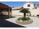 The backyard boasts desert landscaping and a custom planting bed at 8982 Emerald Waters Ct, Las Vegas, NV 89147