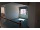 Bright bedroom landing with cozy carpet, window with valence, and ample natural light from the window at 8982 Emerald Waters Ct, Las Vegas, NV 89147