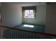 Bright, spacious bonus room with a window dressed in blue curtains, perfect for relaxation or entertainment at 8982 Emerald Waters Ct, Las Vegas, NV 89147
