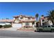 Charming two-story home with landscaped front yard, tile roof, and attached two-car garage at 8982 Emerald Waters Ct, Las Vegas, NV 89147