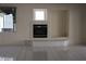 Close-up of fireplace featuring a tile surround and hearth at 8982 Emerald Waters Ct, Las Vegas, NV 89147