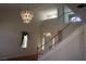 Elegant foyer with high ceilings, a decorative chandelier, and a staircase leading to the upper level at 8982 Emerald Waters Ct, Las Vegas, NV 89147