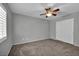 Bedroom featuring a ceiling fan, carpet, and closet at 9104 Pearl Cotton Ave, Las Vegas, NV 89149