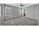 Bright bedroom with gray walls, carpet flooring, white trim, and windows with shutter-style blinds at 9104 Pearl Cotton Ave, Las Vegas, NV 89149