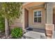 Close-up of front door with charming front yard landscaping at 9104 Pearl Cotton Ave, Las Vegas, NV 89149