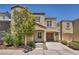 Charming two-story home featuring a balcony, covered parking, and a well-maintained front yard at 9104 Pearl Cotton Ave, Las Vegas, NV 89149