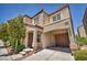 Inviting two-story home with an attached garage and covered entrance at 9104 Pearl Cotton Ave, Las Vegas, NV 89149