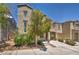 Charming two-story home with covered parking and mature landscaping in a well-maintained front yard at 9104 Pearl Cotton Ave, Las Vegas, NV 89149