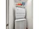 Compact laundry closet with stacked washer and dryer unit at 9104 Pearl Cotton Ave, Las Vegas, NV 89149