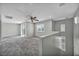 Spacious living room with a ceiling fan, neutral paint, carpet, and sliding doors at 9104 Pearl Cotton Ave, Las Vegas, NV 89149
