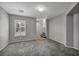 Bright living room features plush carpet, natural light, and neutral paint at 9104 Pearl Cotton Ave, Las Vegas, NV 89149