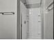 Updated bathroom featuring a white shower and neutral tile at 9104 Pearl Cotton Ave, Las Vegas, NV 89149