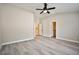Expansive bedroom with vaulted ceiling, ceiling fan, and light wood floors at 9514 Teton Vista Ave, Las Vegas, NV 89117