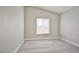 Neutral bedroom featuring a window with natural light and light wood flooring at 9514 Teton Vista Ave, Las Vegas, NV 89117