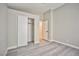 Bedroom featuring wood floors, closet, and adjacent room at 9514 Teton Vista Ave, Las Vegas, NV 89117