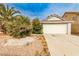Charming single-story home with well-maintained landscaping and attached two-car garage at 9514 Teton Vista Ave, Las Vegas, NV 89117