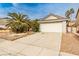 Charming single-story home featuring a two-car garage, a driveway, and low maintenance landscaping at 9514 Teton Vista Ave, Las Vegas, NV 89117