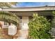 A house with a welcoming front door and mature landscaping at 9514 Teton Vista Ave, Las Vegas, NV 89117