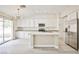 Modern kitchen with white cabinets, stainless steel appliances, and a large island at 9514 Teton Vista Ave, Las Vegas, NV 89117