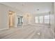 Bright and airy living room features stylish plank flooring, neutral tones, and plenty of natural light at 9514 Teton Vista Ave, Las Vegas, NV 89117