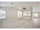 Spacious living room with an open floor plan and stylish plank flooring at 9514 Teton Vista Ave, Las Vegas, NV 89117