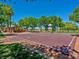 Outdoor basketball court with red surface, white lines, hoop and a covered pavilion nearby, great for community recreation at 9517 Mountainair Ave, Las Vegas, NV 89134