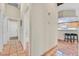 Hallway with tile flooring and access to the kitchen, laundry, and bathroom at 9517 Mountainair Ave, Las Vegas, NV 89134