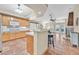 Modern kitchen overlooking the living area, featuring tile floors, updated cabinets, and a breakfast bar at 9517 Mountainair Ave, Las Vegas, NV 89134
