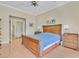 Spacious main bedroom with wood floors, ceiling fan, and ensuite bath at 9517 Mountainair Ave, Las Vegas, NV 89134