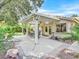 Inviting covered patio with dining set, ceiling fan, and access to the home through French doors at 9517 Mountainair Ave, Las Vegas, NV 89134