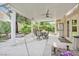 Well-maintained covered patio with outdoor seating and mature shade trees at 9517 Mountainair Ave, Las Vegas, NV 89134